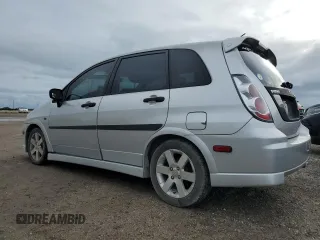 2006 Suzuki Aerio Premium z VIN JS2RC62H265351207, wystawiony jako Copart lot #74980534 z przebiegiem 64 199 mil mil oraz Nie do naprawy. Historia ofert i sprzedaży dostępna na DreamBid. Obrazek 2.