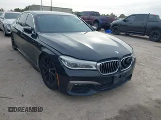 2016 BMW 7 Series 750i xDrive with VIN WBA7F2C51GG415021, listed as a IAAI auction lot 41292087 with 72,590 mi miles. Bid and sale history available at carsss.com. Image 1.
