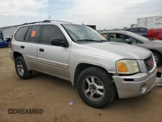 2005 GMC Envoy SLT with VIN 1GKDT13S152124404, listed as a Copart auction lot 64011494 with 212,951 mi miles and Salvage Title. Bid and sale history available at DreamBid. Image 4.