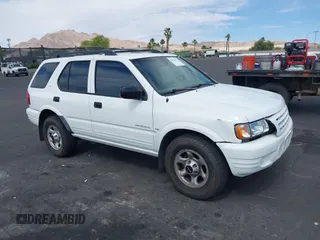 2001 Isuzu Rodeo S z VIN 4S2CK58W614329085, wystawiony jako IAAI lot #42303013 z przebiegiem 171 933 mil mil oraz . Historia ofert i sprzedaży dostępna na DreamBid. Obrazek 1.