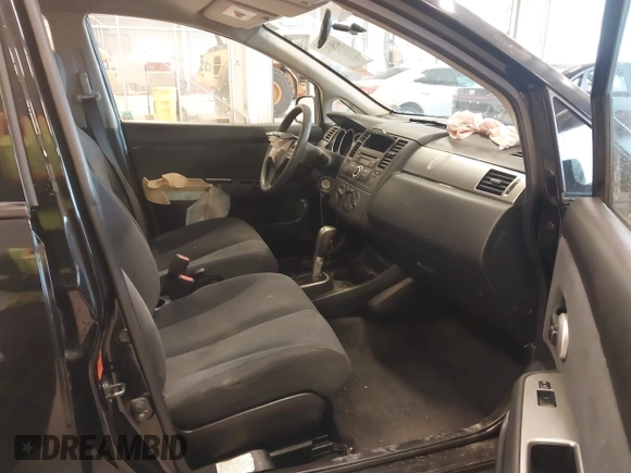 2009 Nissan Versa 1.8 S with VIN 3N1BC11E99L438342, listed as a IAAI auction lot 41561812 with 152,141 mi miles. Bid and sale history available at carsss.com. Image 5.