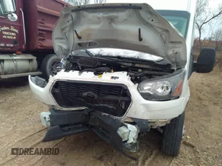 2022 Ford Transit Cargo with VIN 1FTBR3U84NKA63761, listed as a IAAI auction lot 41100280 with 90,993 mi miles and . Bid and sale history available at DreamBid. Image 6.