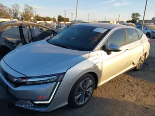 2018 Honda Clarity with VIN JHMZC5F15JC018312, listed as a IAAI auction lot 41354648 with 97,035 mi miles and . Bid and sale history available at DreamBid. Image 18.
