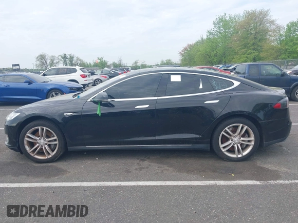 2014 Tesla Model S 60 with VIN 5YJSA1H13EFP33693, listed as a IAAI auction lot 42132094 with Not Provided miles and . Bid and sale history available at DreamBid. Image 13.