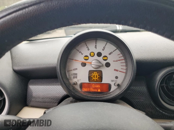 2012 MINI Hardtop S with VIN WMWSV3C53CTY27834, listed as a Copart auction lot 52616845 with 66,919 mi miles and Salvage Title. Bid and sale history available at DreamBid. Image 9.