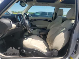 2011 MINI Hardtop with VIN WMWSU3C5XBTX96048, listed as a Copart auction lot 57607955 with 99,632 mi miles and Salvage title. Bid and sale history available at DreamBid. Image 7.