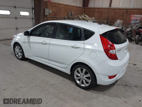 2014 Hyundai Accent SE z VIN KMHCU5AE4EU163402, wystawiony jako IAAI lot #41755872 z przebiegiem 161 017 mil mil oraz . Historia ofert i sprzedaży dostępna na DreamBid. Obrazek 3.