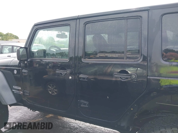 2015 Jeep Wrangler Unlimited Willys Wheeler with VIN 1C4BJWDG4FL687829, listed as a IAAI auction lot 42099147 with 98,969 mi miles and . Bid and sale history available at DreamBid. Image 15.