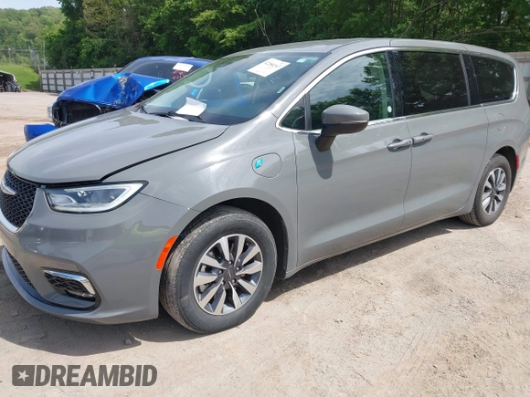 2023 Chrysler Pacifica Hybrid Touring L with VIN 2C4RC1L73PR522988, listed as a IAAI auction lot 42280263 with 54,939 mi miles and . Bid and sale history available at DreamBid. Image 2.