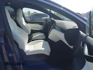 2019 Tesla Model X 75D with VIN 5YJXCBE22KF184504, listed as a IAAI auction lot 41802023 with 137,094 mi miles. Bid and sale history available at carsss.com. Image 5.