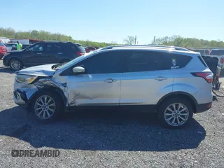 2018 Ford Escape Titanium with VIN 1FMCU9J96JUA33500, listed as a IAAI auction lot 42121736 with 105,430 mi miles and . Bid and sale history available at DreamBid. Image 14.