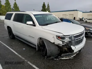 2015 Chevrolet Suburban LS with VIN 1GNSCHKC9FR667540, listed as a Copart auction lot 80908574 with 125,428 mi miles and Salvage title. Bid and sale history available at DreamBid. Image 4.