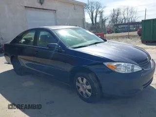 2002 Toyota Camry LE z VIN JTDBE32KX20111362, wystawiony jako IAAI lot #41820475 z przebiegiem 270 091 mil mil oraz . Historia ofert i sprzedaży dostępna na DreamBid. Obrazek 13.