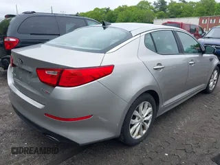 2014 Kia Optima EX z VIN 5XXGN4A70EG335090, wystawiony jako IAAI lot #42272655 z przebiegiem 165 795 mil mil oraz . Historia ofert i sprzedaży dostępna na DreamBid. Obrazek 4.