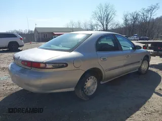 1999 Mercury Sable LS z VIN 1MEFM53S7XA622932, wystawiony jako IAAI lot #41708531 z przebiegiem 155 702 mil mil oraz . Historia ofert i sprzedaży dostępna na DreamBid. Obrazek 4.