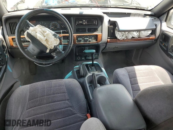 1998 Jeep Grand Cherokee Laredo with VIN 1J4GZ58S4WC244954, listed as a Copart auction lot 55731465 with 205,766 mi miles and Salvage title. Bid and sale history available at DreamBid. Image 8.
