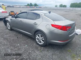 2013 Kia Optima EX z VIN 5XXGN4A78DG196728, wystawiony jako IAAI lot #42242303 z przebiegiem 164 448 mil mil oraz . Historia ofert i sprzedaży dostępna na DreamBid. Obrazek 3.