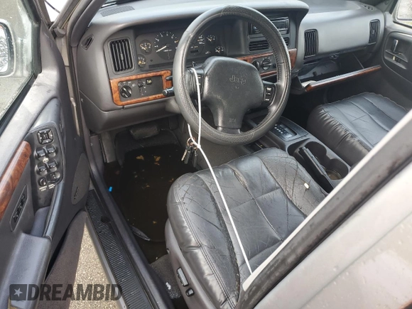 1998 Jeep Grand Cherokee Limited with VIN 1J4GZ78S2WC222768, listed as a Copart auction lot 73942154 with Not provided miles and Salvage title. Bid and sale history available at DreamBid. Image 8.