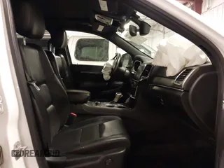 2021 Jeep Grand Cherokee 80th Anniversary with VIN 1C4RJFBG6MC569585, listed as a IAAI auction lot 41341608 with 73,234 mi miles and . Bid and sale history available at DreamBid. Image 5.