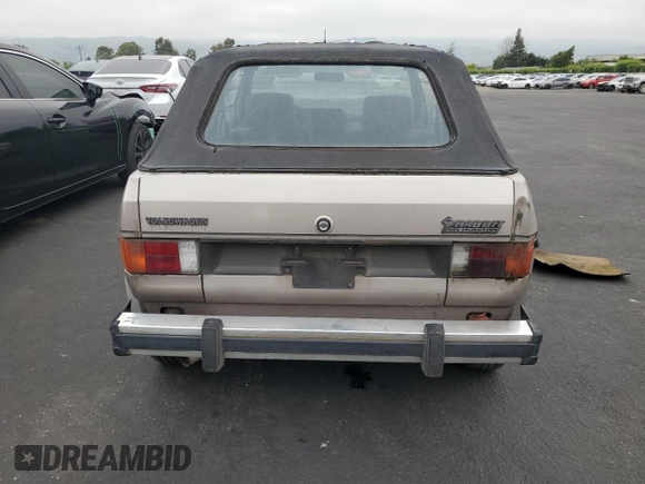 1984 Volkswagen Rabbit z VIN WVWCA0152EK015292, wystawiony jako Copart lot #55503315 z przebiegiem 216 970 mil mil oraz Tytuł czysty. Historia ofert i sprzedaży dostępna na DreamBid. Obrazek 6.