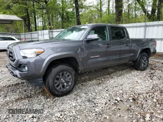 2022 Toyota Tacoma SR5 with VIN 3TYDZ5BN1NT010722, listed as a Copart auction lot 50682085 with 59,965 mi miles and Salvage title. Bid and sale history available at DreamBid. Image 1.
