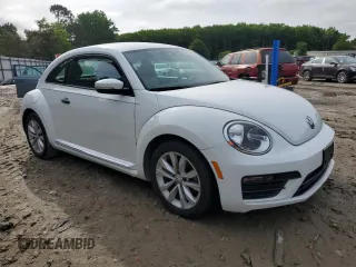 2017 Volkswagen Beetle Fleet with VIN 3VWF17AT2HM631251, listed as a Copart auction lot 58301085 with 107,808 mi miles and Salvage title. Bid and sale history available at DreamBid. Image 4.