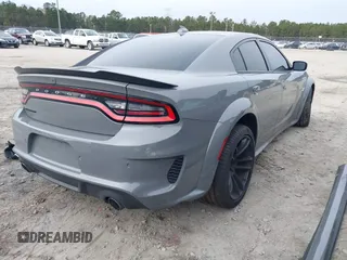 2023 Dodge Charger Scat Pack Widebody with VIN 2C3CDXGJ6PH646050, listed as a IAAI auction lot 41175513 with 7,684 mi miles and . Bid and sale history available at DreamBid. Image 4.