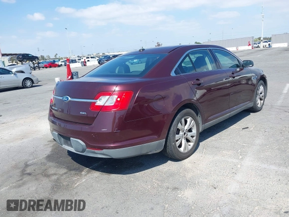 2011 Ford Taurus SEL with VIN 1FAHP2EW8BG137937, listed as a IAAI auction lot 42107586 with 143,525 mi miles. Bid and sale history available at carsss.com. Image 4.