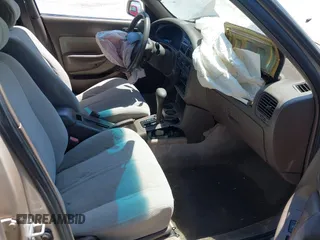 1995 Toyota Camry LE z VIN 4T1SK12E8SU872841, wystawiony jako IAAI lot #42025861 z przebiegiem 228 747 mil mil oraz . Historia ofert i sprzedaży dostępna na DreamBid. Obrazek 5.