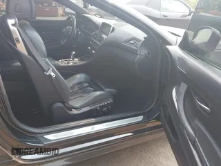2014 BMW M6 z VIN WBSLZ9C5XEDZ78402, wystawiony jako IAAI lot #42399055 z przebiegiem 127 803 mil mil oraz . Historia ofert i sprzedaży dostępna na DreamBid. Obrazek 5.