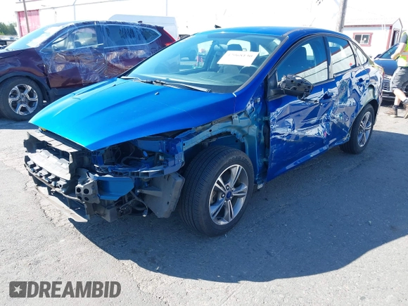 2018 Ford Focus SE z VIN 1FADP3FE4JL279265, wystawiony jako IAAI lot #42068130 z przebiegiem 43 616 mil mil oraz . Historia ofert i sprzedaży dostępna na DreamBid. Obrazek 2.