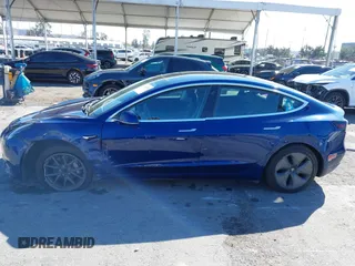 2019 Tesla Model 3 Mid Range with VIN 5YJ3E1EA8KF436086, listed as a IAAI auction lot 41682093 with 70,332 mi miles and . Bid and sale history available at DreamBid. Image 14.
