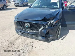 2019 Mazda CX-5 Touring with VIN JM3KFBCM8K0518806, listed as a IAAI auction lot 42038168 with 61,449 mi miles and . Bid and sale history available at DreamBid. Image 6.