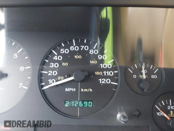 1996 Jeep Grand Cherokee Limited z VIN 1J4GZ78Y3TC191000, wystawiony jako IAAI lot #42259621 z przebiegiem 212 690 mil mil oraz . Historia ofert i sprzedaży dostępna na DreamBid. Obrazek 7.