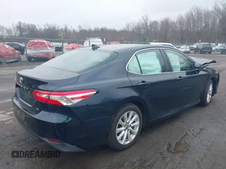 2020 Toyota Camry LE with VIN 4T1L11AK3LU977805, listed as a IAAI auction lot 41907558 with 82,237 mi miles and . Bid and sale history available at DreamBid. Image 4.