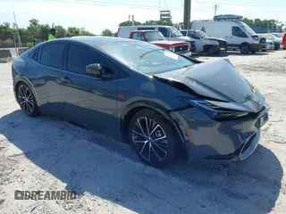 2024 Toyota Prius LE z VIN JTDACAAU4R3023781, wystawiony jako IAAI lot #42114520 z przebiegiem 20 884 mil mil oraz . Historia ofert i sprzedaży dostępna na DreamBid. Obrazek 1.