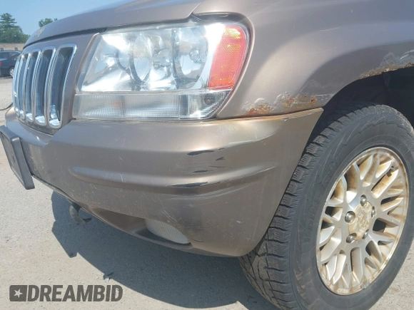 2002 Jeep Grand Cherokee Limited z VIN 1J8GW58N62C213751, wystawiony jako IAAI lot #42478869 z przebiegiem 233 848 mil mil oraz . Historia ofert i sprzedaży dostępna na DreamBid. Obrazek 6.