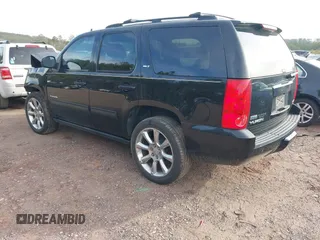 2012 GMC Yukon SLT with VIN 1GKS1CE06CR104447, listed as a IAAI auction lot 41589823 with 183,003 mi miles. Bid and sale history available at carsss.com. Image 3.