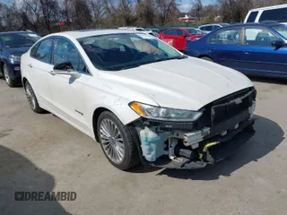 2013 Ford Fusion Titanium Hybrid with VIN 3FA6P0RU1DR357341, listed as a IAAI auction lot 41877818 with 211,537 mi miles. Bid and sale history available at carsss.com. Image 1.