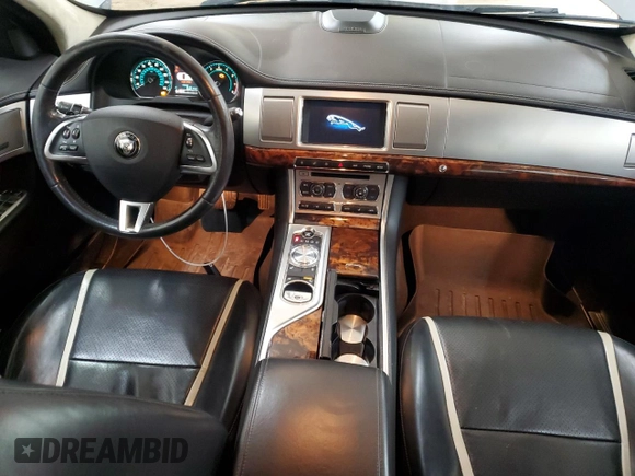 2015 Jaguar XF Portfolio with VIN SAJWJ0FF8F8U65883, listed as a Copart auction lot 55783945 with 133,431 mi miles and Salvage Title. Bid and sale history available at DreamBid. Image 8.