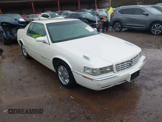 1997 Cadillac Eldorado ESC z VIN 1G6EL12Y6VU614754, wystawiony jako IAAI lot #41543611 z przebiegiem 73 273 mil mil oraz . Historia ofert i sprzedaży dostępna na DreamBid. Obrazek 1.