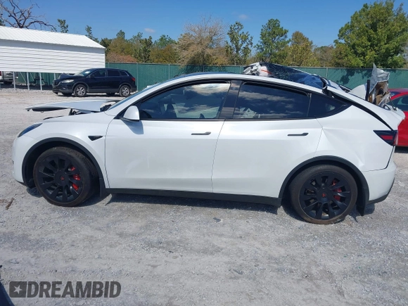2023 Tesla Model Y Long Range with VIN 7SAYGAEE1PF665934, listed as a IAAI auction lot 41780949 with 21,949 mi miles and . Bid and sale history available at DreamBid. Image 13.