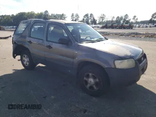 2004 Ford Escape XLS with VIN 1FMYU92134KA21707, listed as a Copart auction lot 72114804 with 219,518 mi miles and Salvage Title. Bid and sale history available at DreamBid. Image 4.