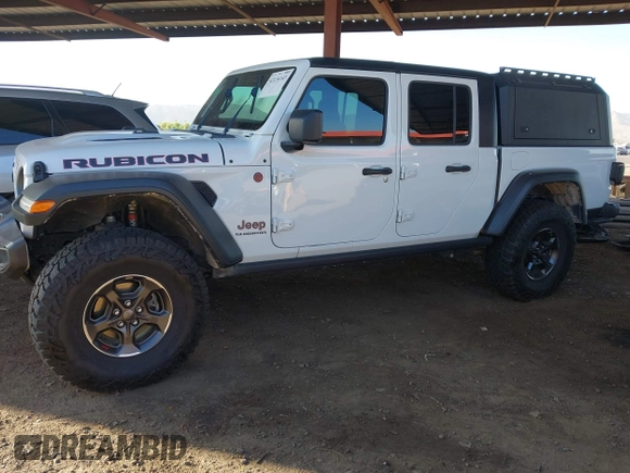 2022 Jeep Gladiator Rubicon with VIN 1C6JJTBM6NL145009, listed as a IAAI auction lot 42134143 with 59,438 mi miles and . Bid and sale history available at DreamBid. Image 17.
