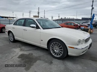 2007 Jaguar XJ 8 with VIN SAJWA71B17SH12746, listed as a Copart auction lot 53844045 with 99,766 mi miles and Salvage Title. Bid and sale history available at DreamBid. Image 4.