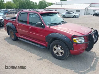 2004 Ford Explorer Sport Trac XLS z VIN 1FMZU77K24UA57323, wystawiony jako IAAI lot #42400475 z przebiegiem 212 260 mil mil oraz . Historia ofert i sprzedaży dostępna na DreamBid. Obrazek 1.