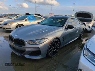 2023 BMW 8 Series M850i with VIN WBAGV8C02PCL20503, listed as a Copart auction lot 74098614 with Not Provided miles and Salvage Title. Bid and sale history available at carsss.com. Image 1.
