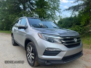 2018 Honda Pilot Touring z VIN 5FNYF6H94JB070661, wystawiony jako Copart lot #60926415 z przebiegiem 205 538 mil mil oraz Czysty tytuł • Clean title. Historia ofert i sprzedaży dostępna na DreamBid. Obrazek 1.