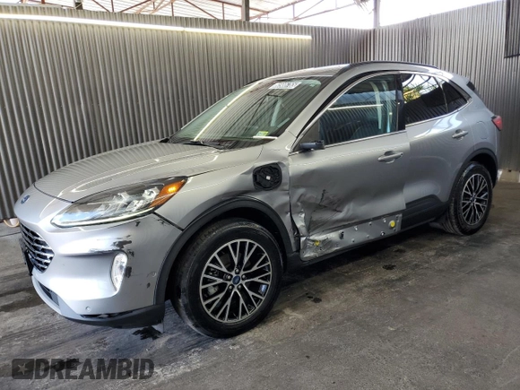 2021 Ford Escape Titanium Plug-In Hybrid z VIN 1FMCU0LZ8MUA66995, wystawiony jako Copart lot #60986765 z przebiegiem 69 609 mil mil oraz Czysty tytuł • Clean title. Historia ofert i sprzedaży dostępna na DreamBid. Obrazek 1.