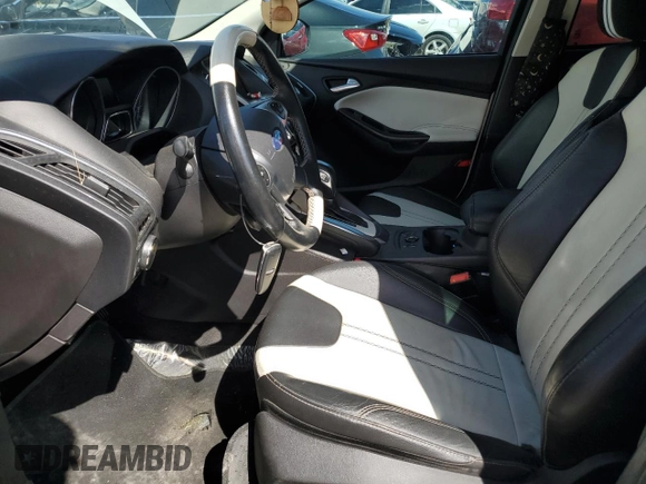 2014 Ford Focus Titanium with VIN 1FADP3J26EL132223, listed as a Copart auction lot 71490004 with 131,233 mi miles and Salvage Title. Bid and sale history available at DreamBid. Image 7.